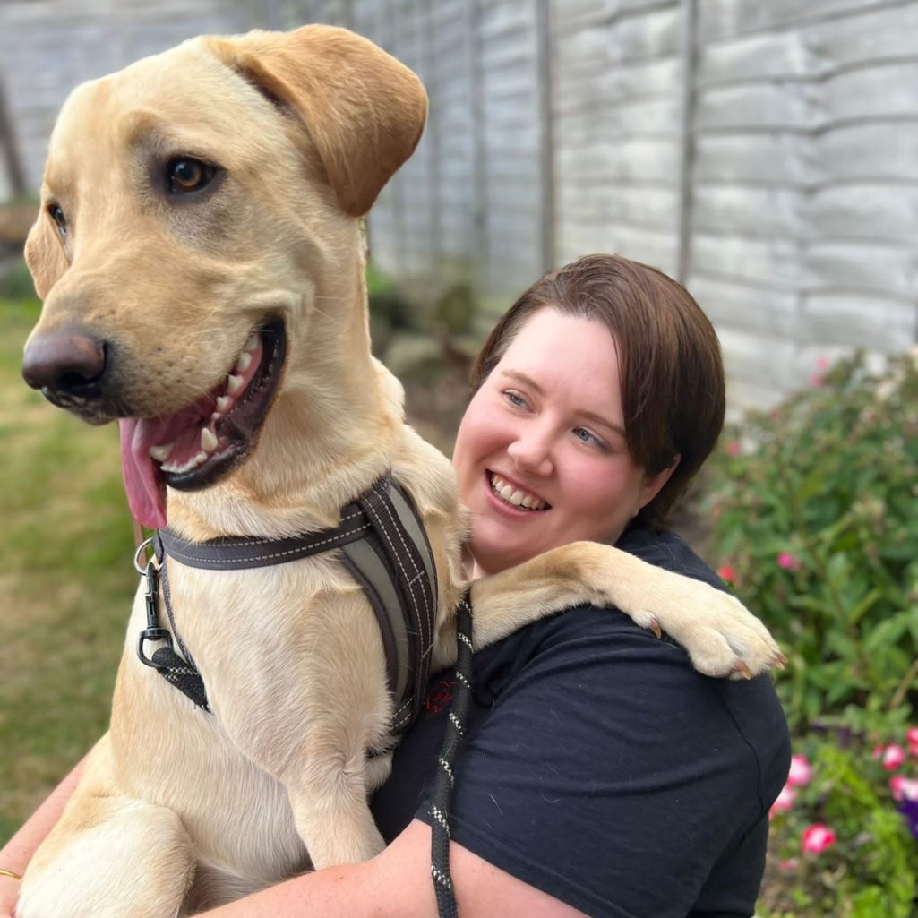 Dog walker and Mum in Bristol with happy Labrador named Jackson during a walk